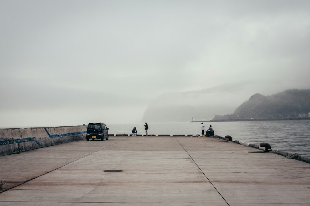 detective on foggy pier