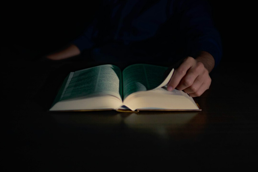 open book on table at night