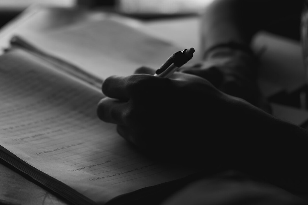 writer dreaming at desk